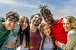 © MandriaPix - portrait of six people smiling in front of the camera on sunny day, multiracial group of friends having fun moments