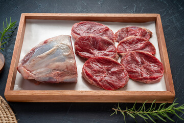 Wall Mural - Fresh Silver shank meat in wooden plate on wooden background, Shank beef first grade in wooden plate on wooden background.