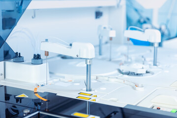 Wall Mural - closeup modern robotical machine for centrifuge testing sample tube with blood. medical laboratory e