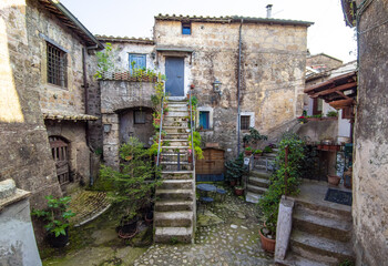 Wall Mural - Calcata (Viterbo, Italy) - The old town of Calcata, perched on a mountain of tufa, overlooking the green Treja river valley, in Lazio region.