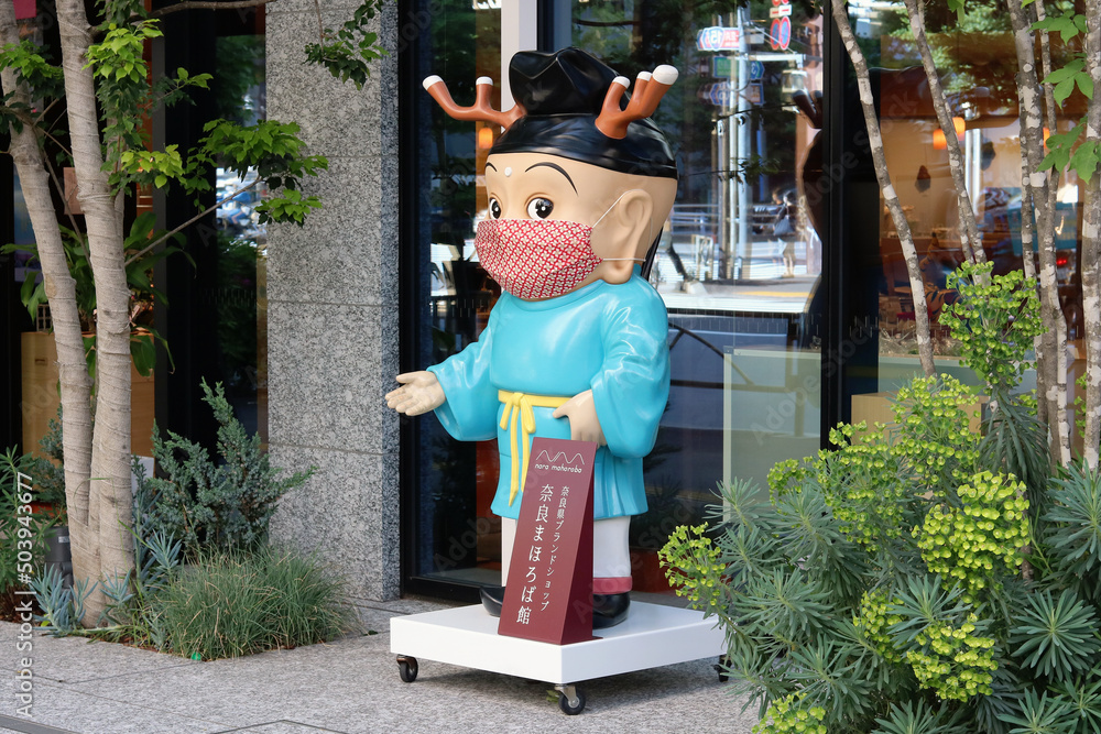 TOKYO, JAPAN - May 10, 2022: Statue of Nara city mascot Sento-Kun outside Nara Mahoroba in Shimbashi - a so-called 'antenna shop' selling products from Nara prefecture.
