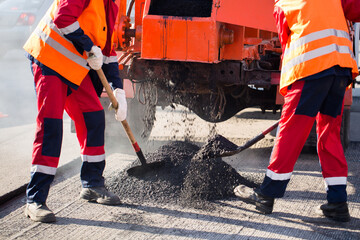 Street resurfacing. Fresh asphalt construction. Bad road