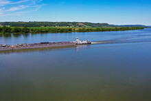 River Barge Traveling Down The Ohio River By Cincinnati, Ohio And Northern Kentucky