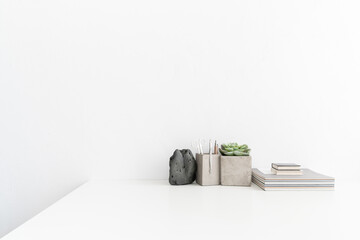 Wall Mural - Desk with papers, office supplies, decorative black stone and bright space. 