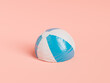 © Antonio Solano - Deflated beach ball with stripes