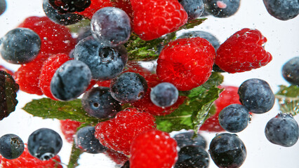 Wall Mural - Close up of various kind of berries in water.
