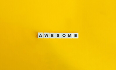 Wall Mural - Awesome Word on Letter Tiles on Yellow Background. Minimal Aesthetics.