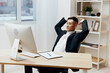 © SHOTPRIME STUDIO - Asian man in a suit sits at a table in front of a computer Lifestyle