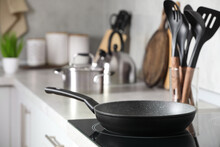 Frying Pan And Cooking Utensils In Kitchen, Space For Text