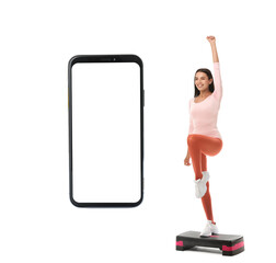 Poster - Sporty young woman and big smartphone with blank screen isolated on white