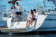 © View Stock - Happy family aboard a yacht out to sea