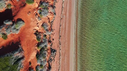 Wall Mural - Aerial drone view of coastal sea shore red cliffs and turquoise water at Peron Peninsula in Shark Bay, Western Australia.