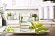 Glass of purified water and jug on kitchen bench closeup
