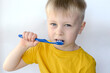 © stanisluva - little boy brushing his teeth