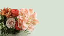 A Bouquet Of Peach Daylilies, Orange And Pink Roses And Beige Chrysanthemums On Light Green Background. Closeup. Long Banner