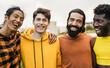 Multiethnic diverse male friends having fun together outdoor - Focus on bearded man