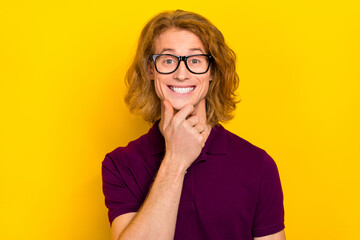 Canvas Print - Portrait of cheerful nice person arm touch chin beaming smile isolated on yellow color background