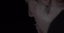 Young Man With Cigarette Smoking In A Dark Room. - Closeup Shot, Slomo