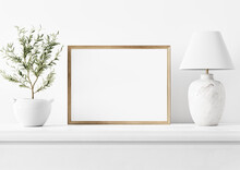 Painting Art Mockup With Empty Horizontal Wooden Frame Standing In Simple Traditional Home Interior With Small Olive Tree And Classic Marble Lamp On White Background. Illustration, 3d Rendering
