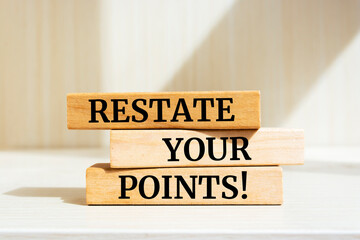 Wall Mural - Wooden blocks with words 'RESTATE YOUR POINTS'.