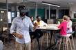 © WavebreakMediaMicro - Caucasian businessman wearing vr headset against multiracial colleagues in meeting at workplace