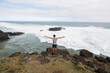 © Studio Peace - Happy man standing on the peak of the mountain, over looking the ocean. Success, winner, happiness.