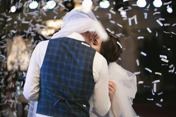 Canvas Print - Happy wedding couple performs the first dance in a restaurant. Romantic moments