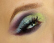 Dark violet light blue and electric green makeup.  Beautiful dark arabic colorful makeup