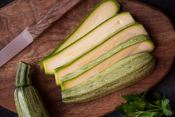 Wall Mural - Fresh zucchini on cutting board, healthy vegetable meal