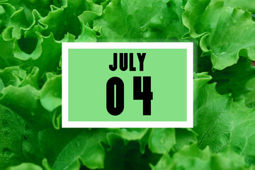 calendar date oncalendar date on the background of green lettuce leaves.  July 4 is the fourth day of the month