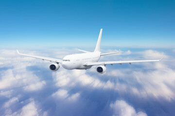 Wall Mural - Aircraft flies motion effect high in the sky over the clouds, traveling in the celestial expanse.