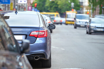 Wall Mural - City traffic with cars parked in line on street side