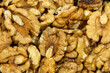 Large Quantity of Walnuts Stacked Together