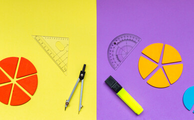 Wall Mural - Multicolored fractions, rulers, pencils on a yellow violet background. Interesting, fun math for kids. Education, back to school concept
