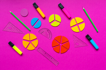 Wall Mural - Multicolored fractions, rulers, pencils on a magenta pink background. Interesting, fun math for kids. Education, back to school concept