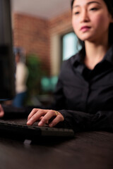 Close up of system developer writing lines of codes in order to build a anomaly analyser for database. Cyber security agency network developer doing ethical hacking to retrieve encrypted stolen data.