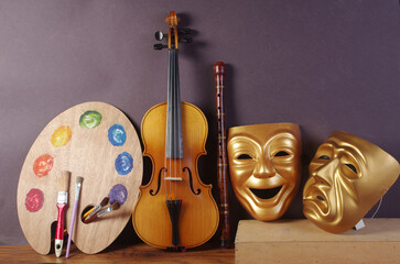 Sticker - Attributes of the arts. Painting, music, theater. Art palette, brushes, violin, theater masks 