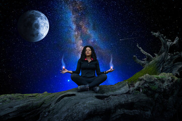 Wall Mural - woman meditating and observing the universe