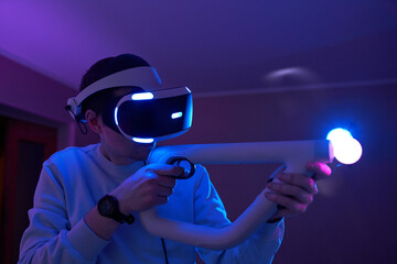 Wall Mural - man with virtual reality headset and joystic is playing game