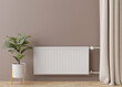White heating radiator with thermostat on brown wall. Central heating system. Free, copy space for your text. 3D rendering.