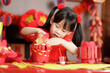 young Chinese girl making traditional Chinese 
