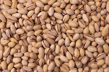 Wall Mural - background of unpeeled almond nuts, close up