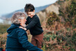 © 23_stockphotography - grandfather playing with his grandson outdoors