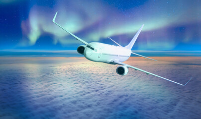 Wall Mural - Northern Lights (Aurora Borealis) with commercial passenger airplane