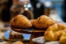 Close-Up Of Croissants And Danish Pastries For Sale In A Cafe