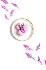 Wall Mural - Trendy woman pattern with flowers and macaroons on plate top view mockup