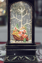 Retro Flashlight With A Figure Of Santa On A Sleigh. Christmas Decoration.