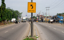 A Road Sign Shows That There Is A Bend Ahead In  Lagos