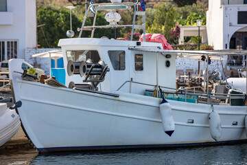 Wall Mural - Fishing boat anchored at Kythnos island harbor. Greece, Cyclades. Summer holiday