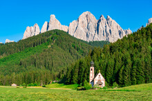 Church of St. John of Nepomuk in front of Odle mountain in Funes Valley of Dolomite South Tyrol Italy. View of San Giovanni Church or St. John's Church or St. Johann Church in village of Ranui Italy.